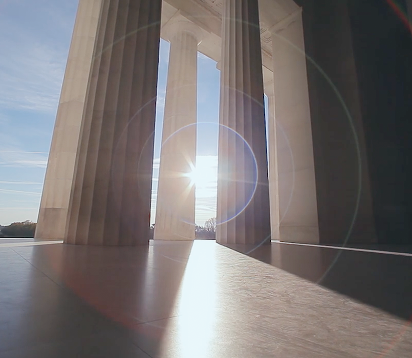 Image of sun shining on government building