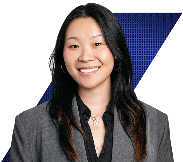 Headshot of a Florina Yang of Vista Equity Partners smiling wearing a grey blazer and a silver heart necklace.