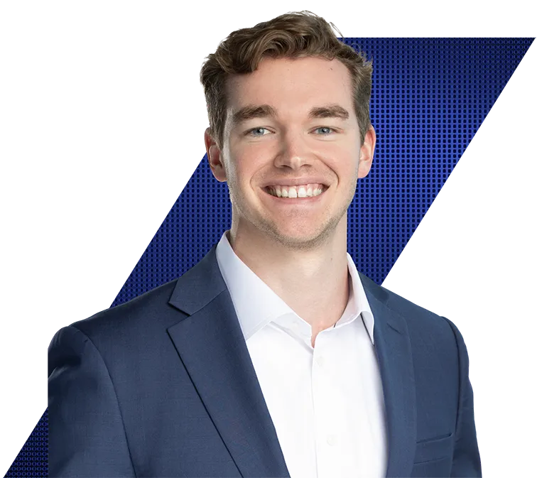 Headshot of a smiling young man in a blue suit jacket and white shirt against a black and blue geometric background.