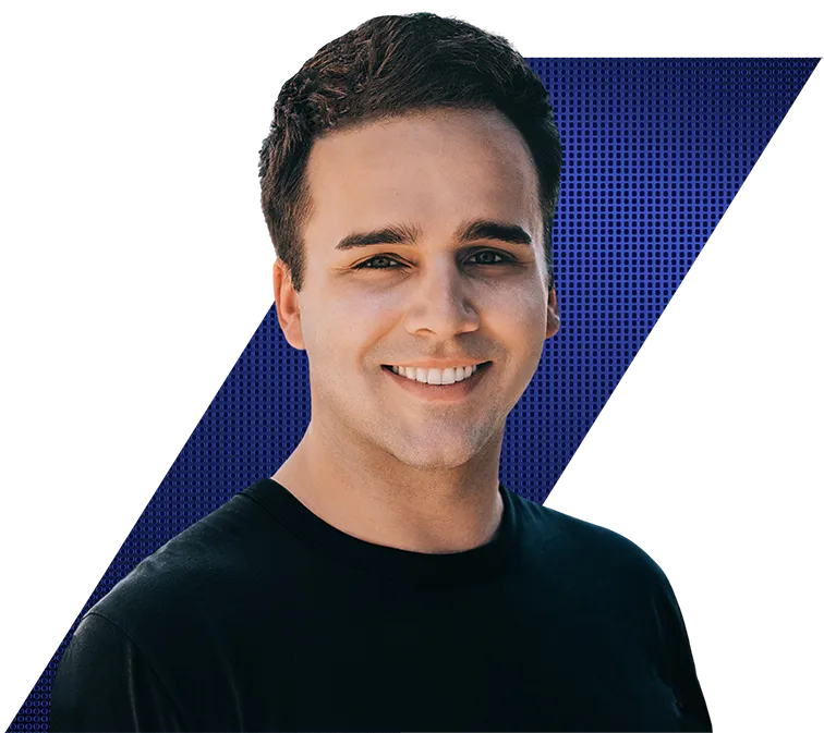 Headshot of a smiling young man in a black t-shirt against a black and blue geometric background.