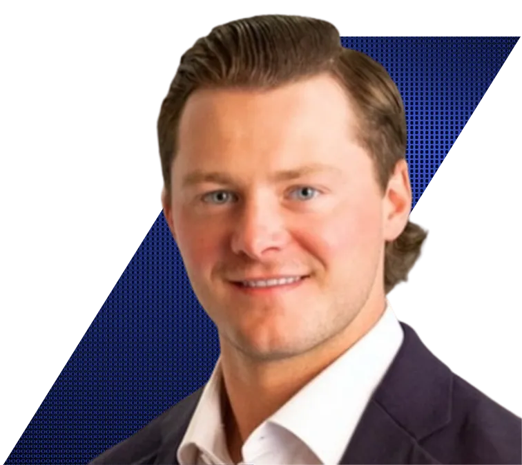 Headshot of Sean Sperzel of Vista Equity Partners with light brown hair and blue eyes, wearing a dark suit jacket and white shirt, against a black and blue patterned background.