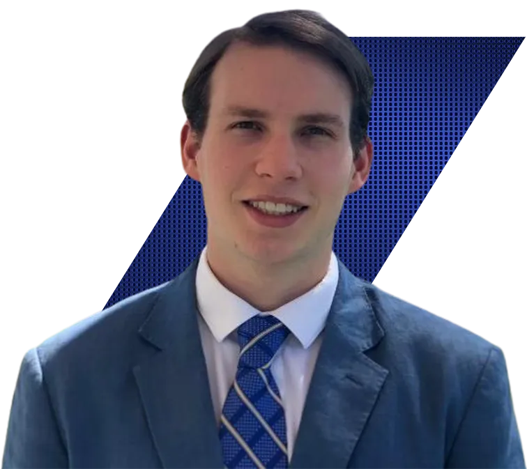 Headshot of William Turner of Vista Equity Partners in a blue suit and striped tie against a black and blue patterned background.
